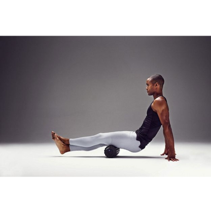 Man using the 4-Speed Vibrating Foam Roller for muscle recovery and performance enhancement.