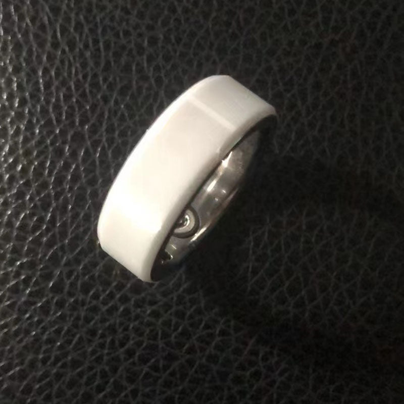 Smart Health Ring Bluetooth Black on a textured black background, showcasing its sleek design and technology.