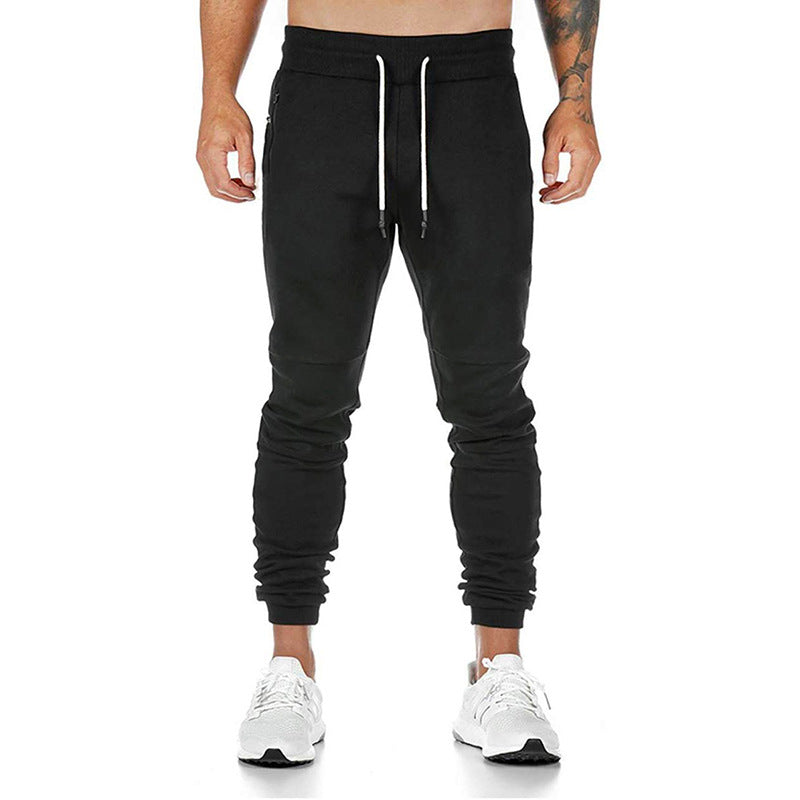 Men's drawstring track pants in black with fitted cuffs and drawstring waist, ideal for exercise or casual wear.
