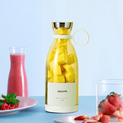 Portable Electric Mini Juicer filled with fresh fruits, ideal for healthy living and on-the-go juicing.