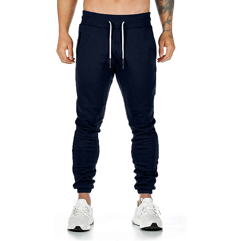 Men's drawstring track pants in navy color, designed for comfort and performance.