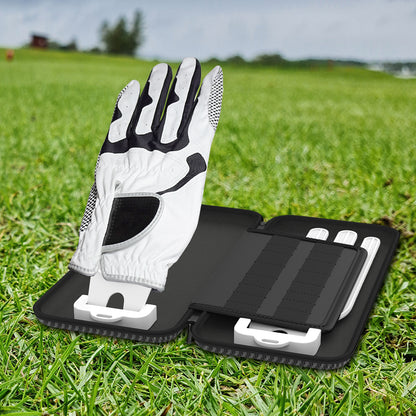 Double glove bag with golf glove and brackets for marking storage on green grass.